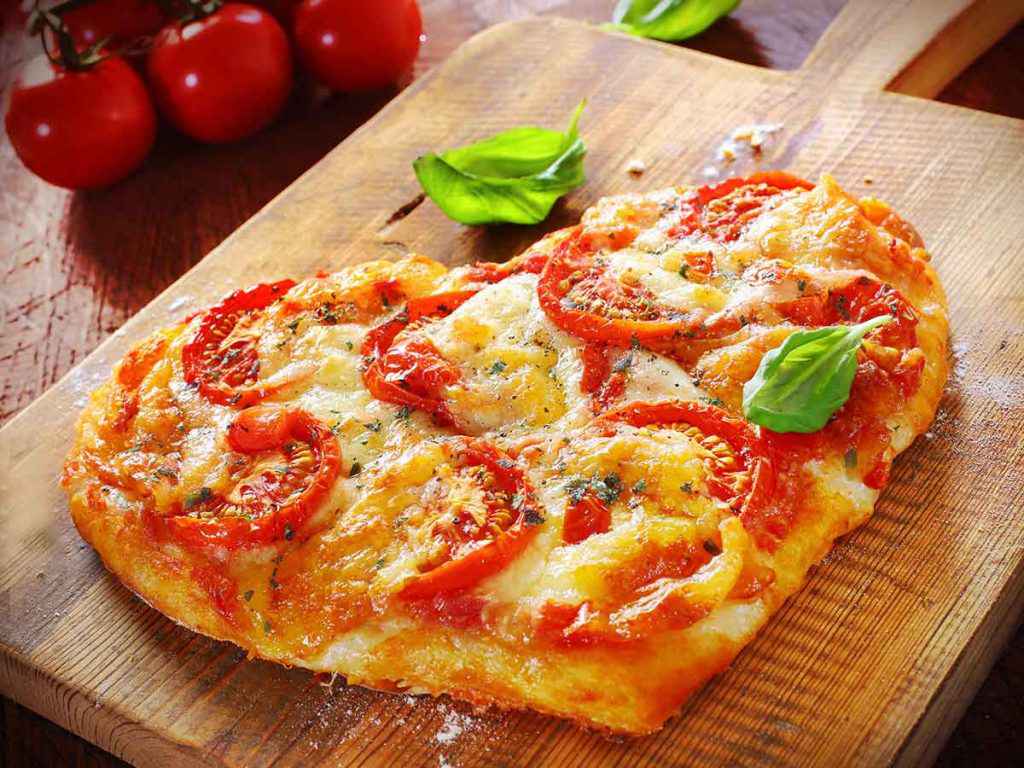 Pizza Day, giornata mondiale (una pizza a forma di cuore)
