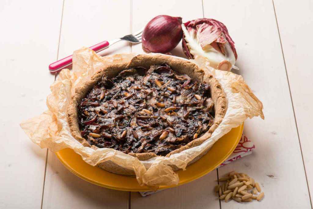 torta salata rustica al radicchio con cipolla e pinoli