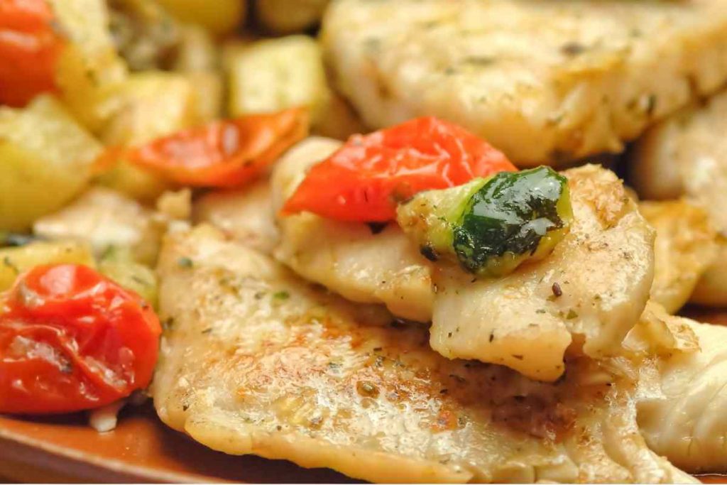 Merluzzo alla contadina con patate, pomodori e zucchine