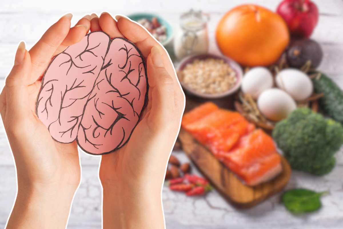 simbolo del cervello in mano e alimenti sul tavolo