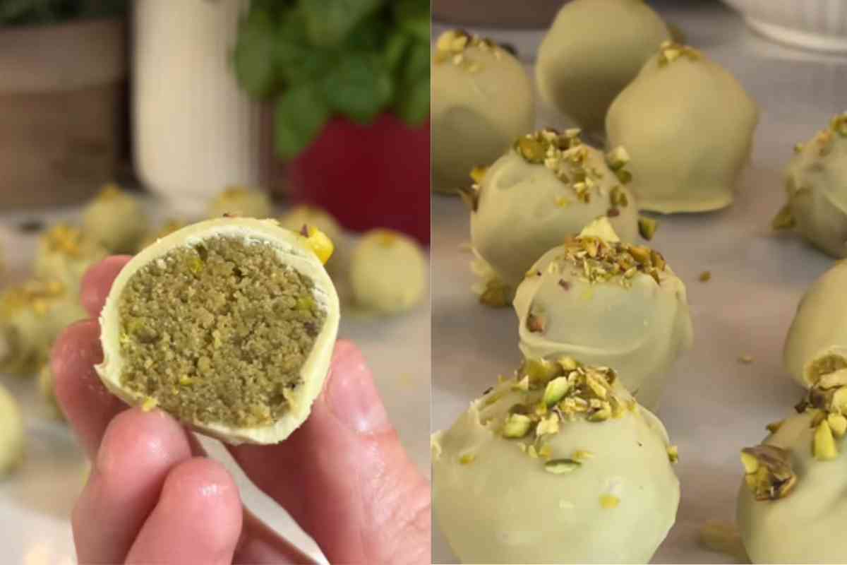 vassoio con pop corn al pistacchio e uno aperto a metà tra le dita