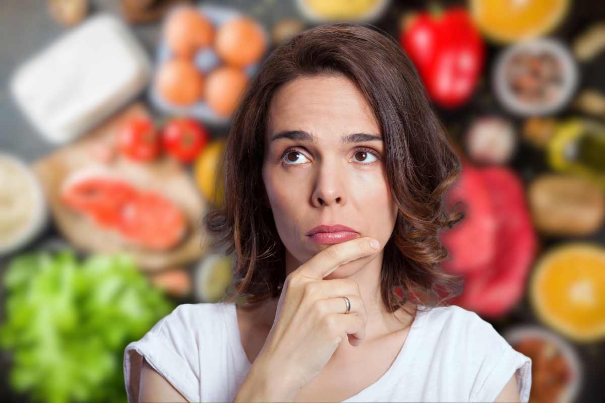 donna in primo piano e alimenti sullo sfondo