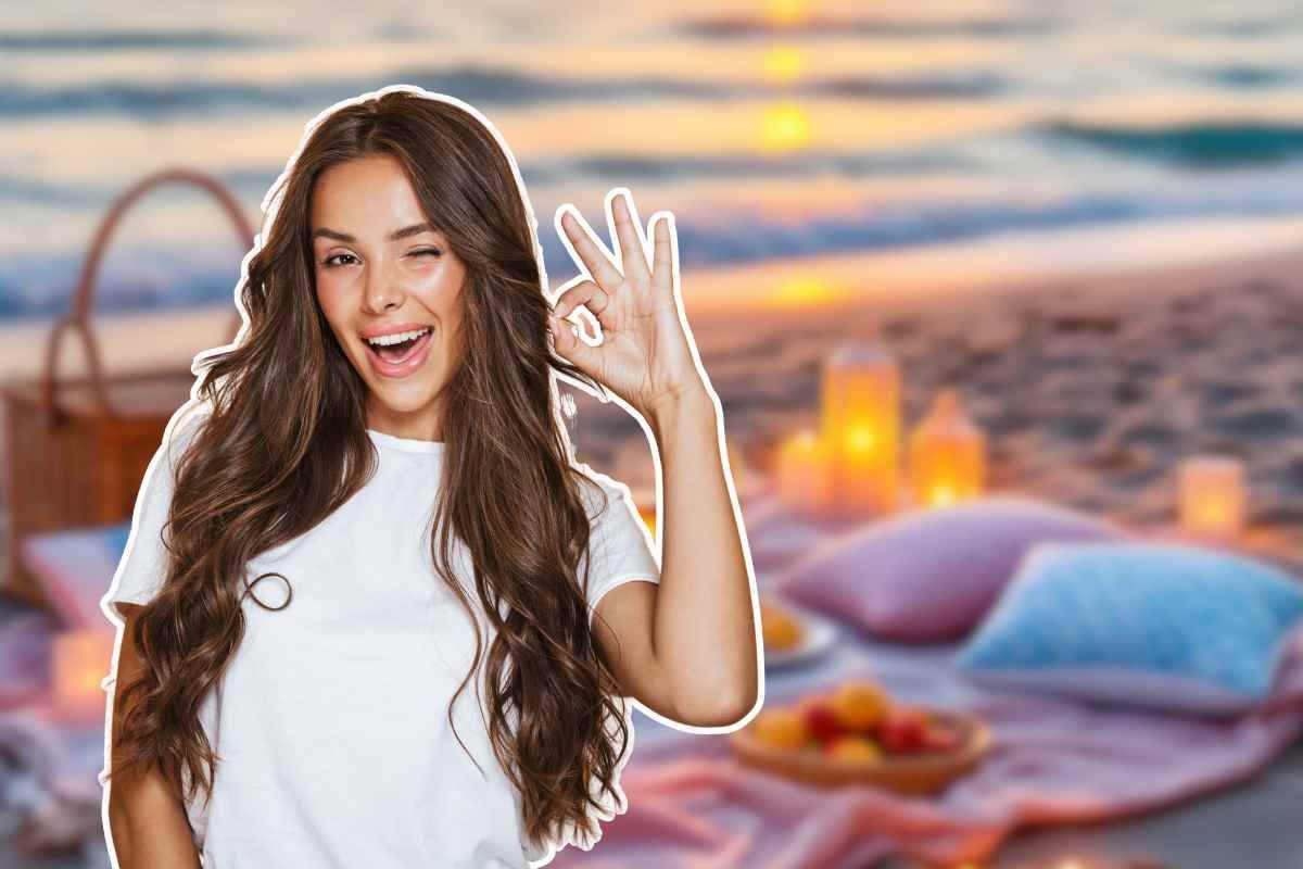 ragazza in primo piano e spiaggia sullo sfondo
