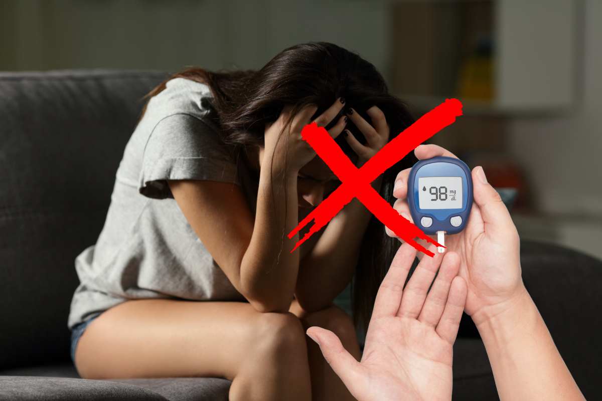 Una donna preda dell'ansia ed una misurazione della glicemia