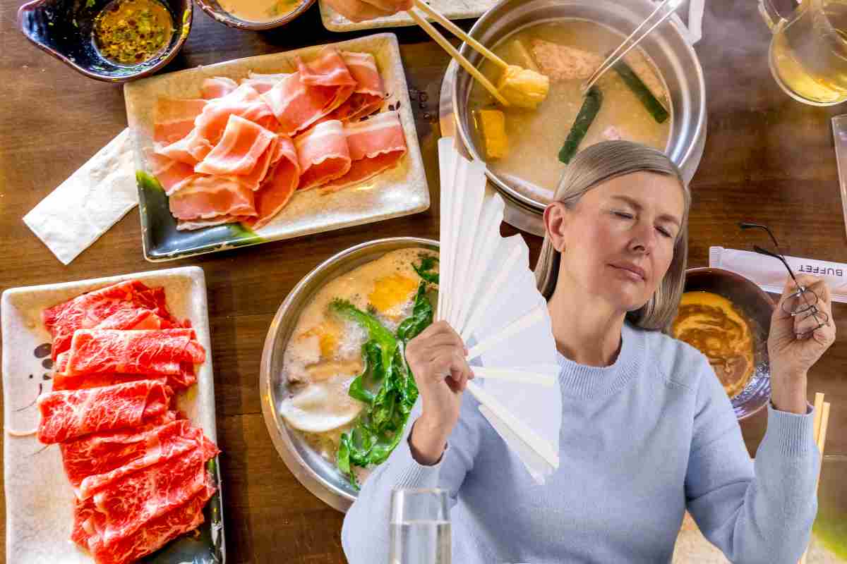 Una donna che ha caldo ed una tavola apparecchiata