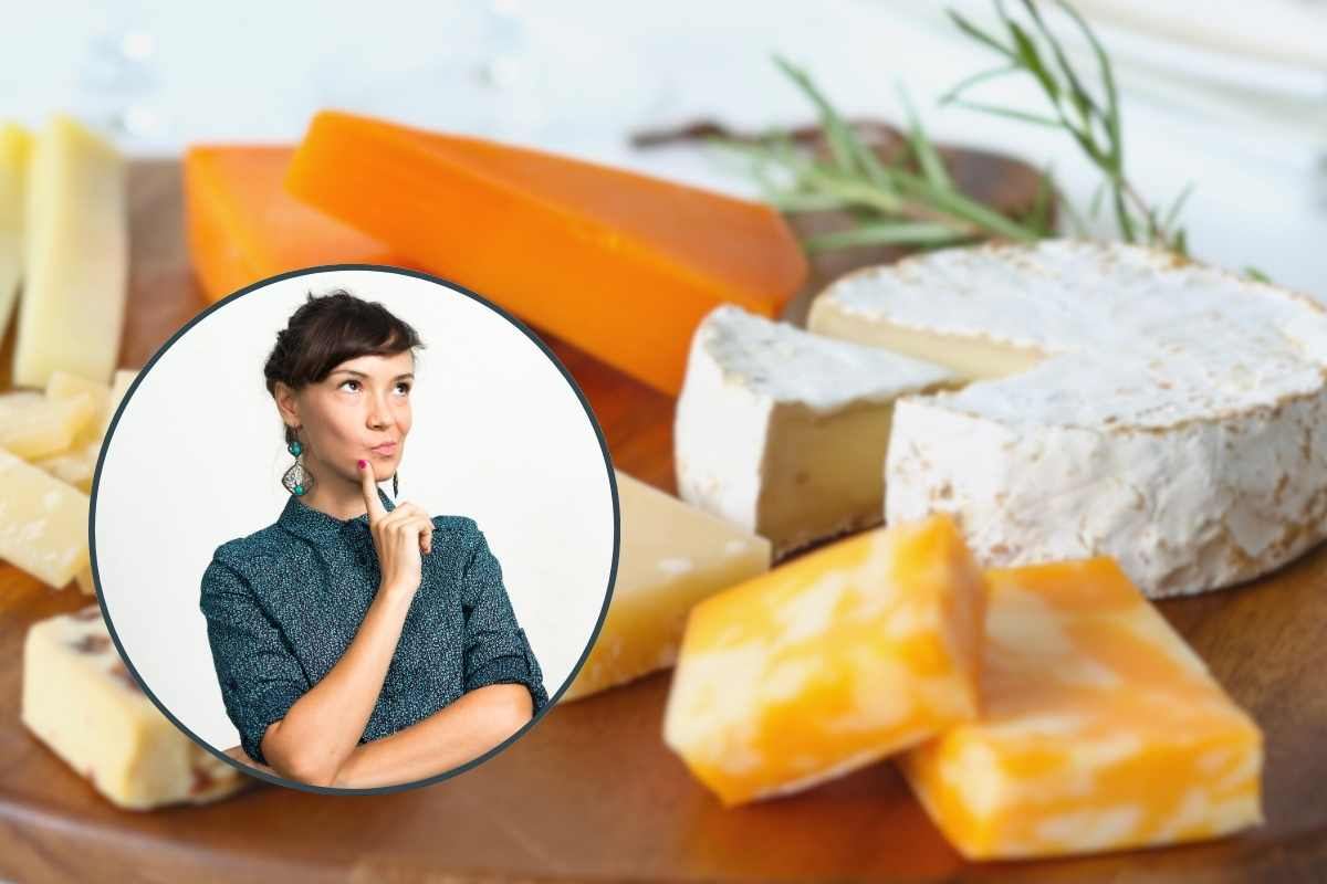 formaggi sul tagliere e donne pensierosa in cornice