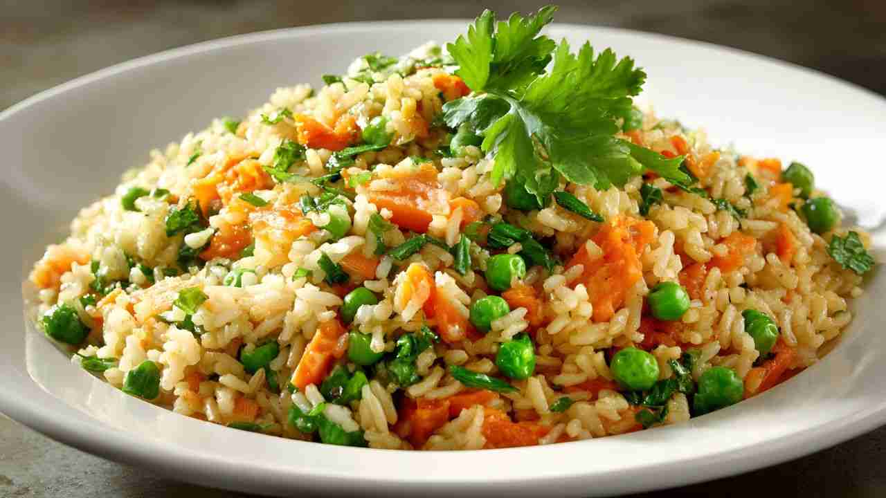 Riso cremoso in una pentola buttalapasta.it