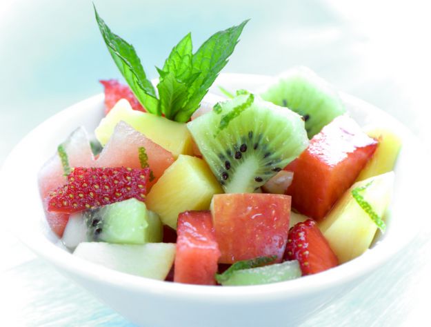 bowl of fruit salad on blue