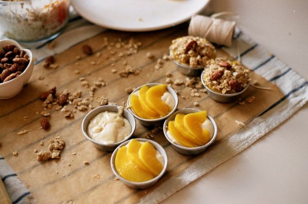 peach cream cakes: white cake, vanilla bean pastry cream filling, peaches topped w brown sugar/oatmeal streusel and sugared almonds