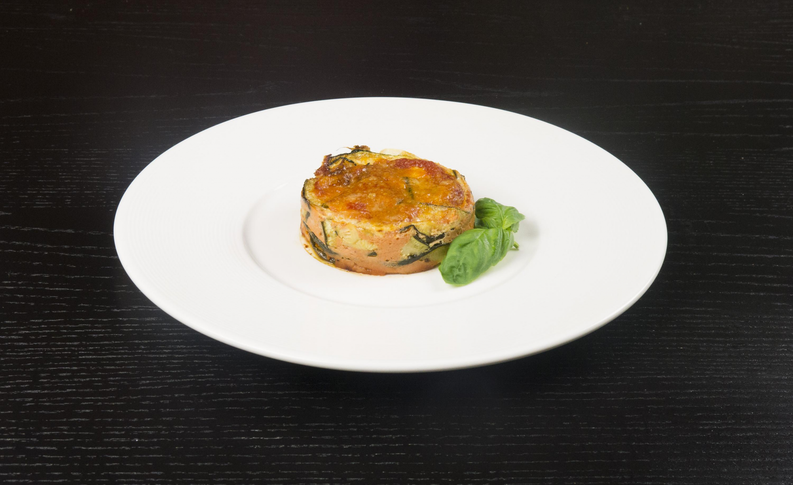 Videoricetta della parmigiana rossa di zucchine